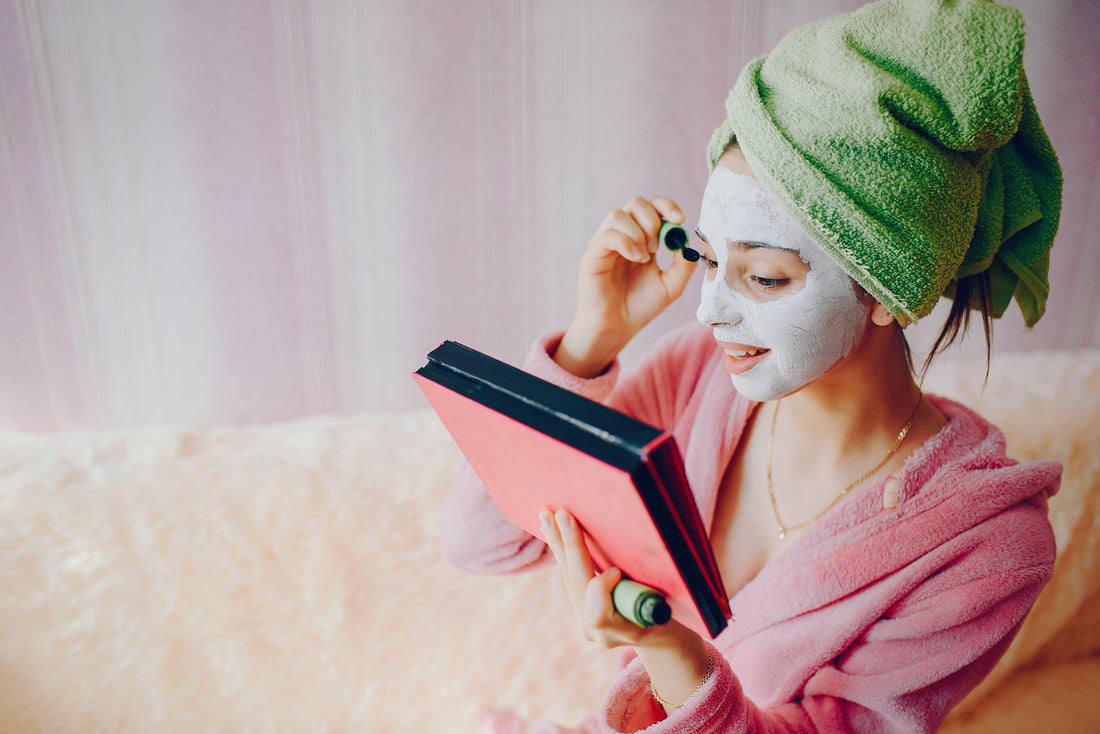 Girl sitting in sofa and doing skincare